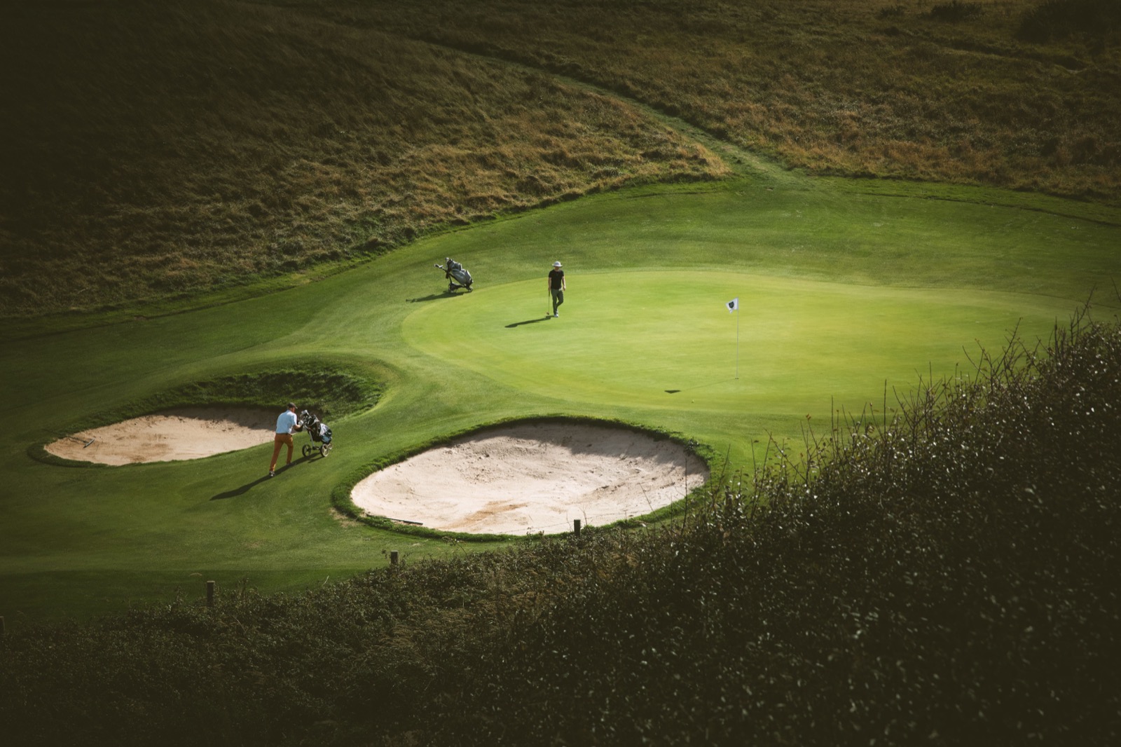 Panoramic view of a championship golf course at dawn